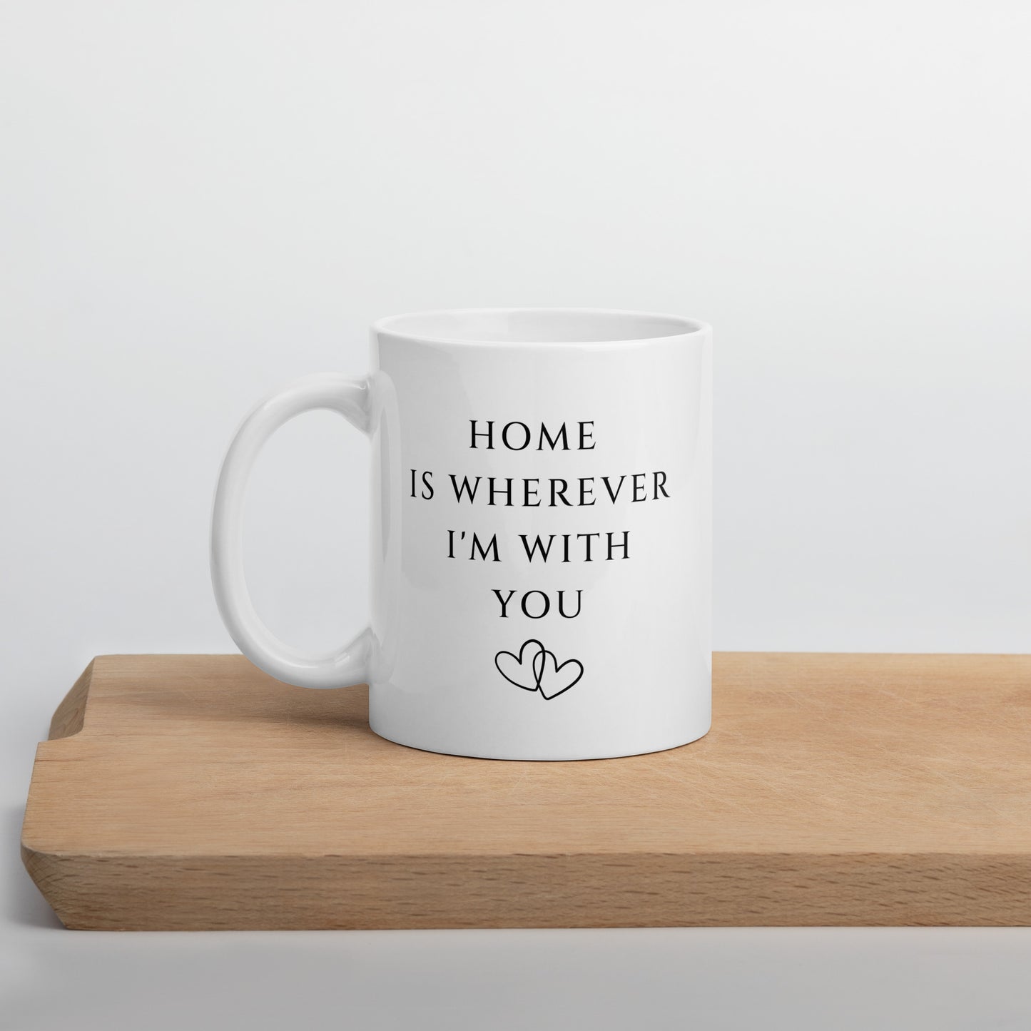 11 oz Home is Wherever I'm With You 11 oz ceramic mug on cutting board