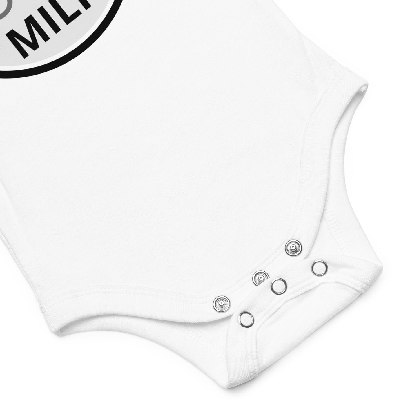 A "Made with 100% Real Local Milk" baby bodysuit featuring snap closures for easy changing.