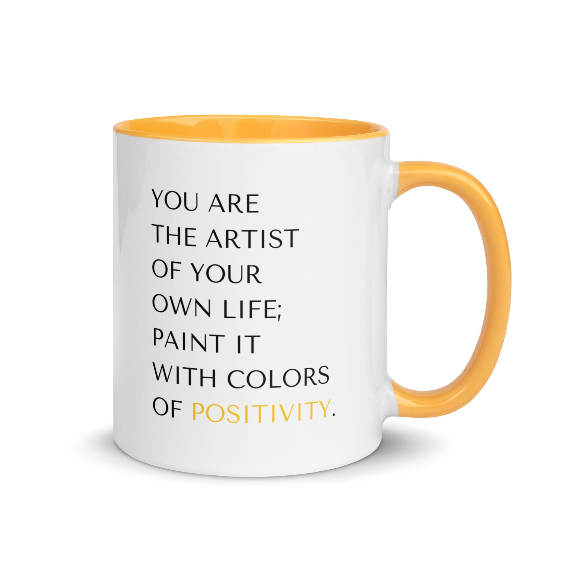 White ceramic 11 oz inspirational positivity mug with golden yellow inner color and on handle for a mood boost