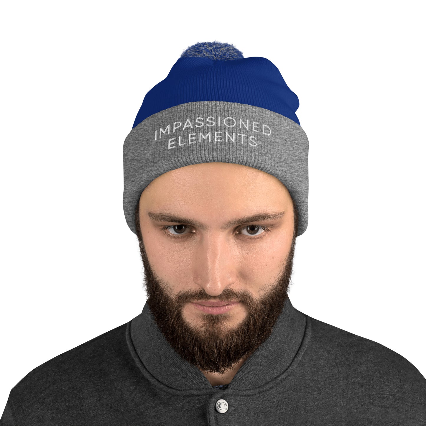 Mysterious male model donning a royal blue and heather grey Impassioned Elements pom-pom beanie