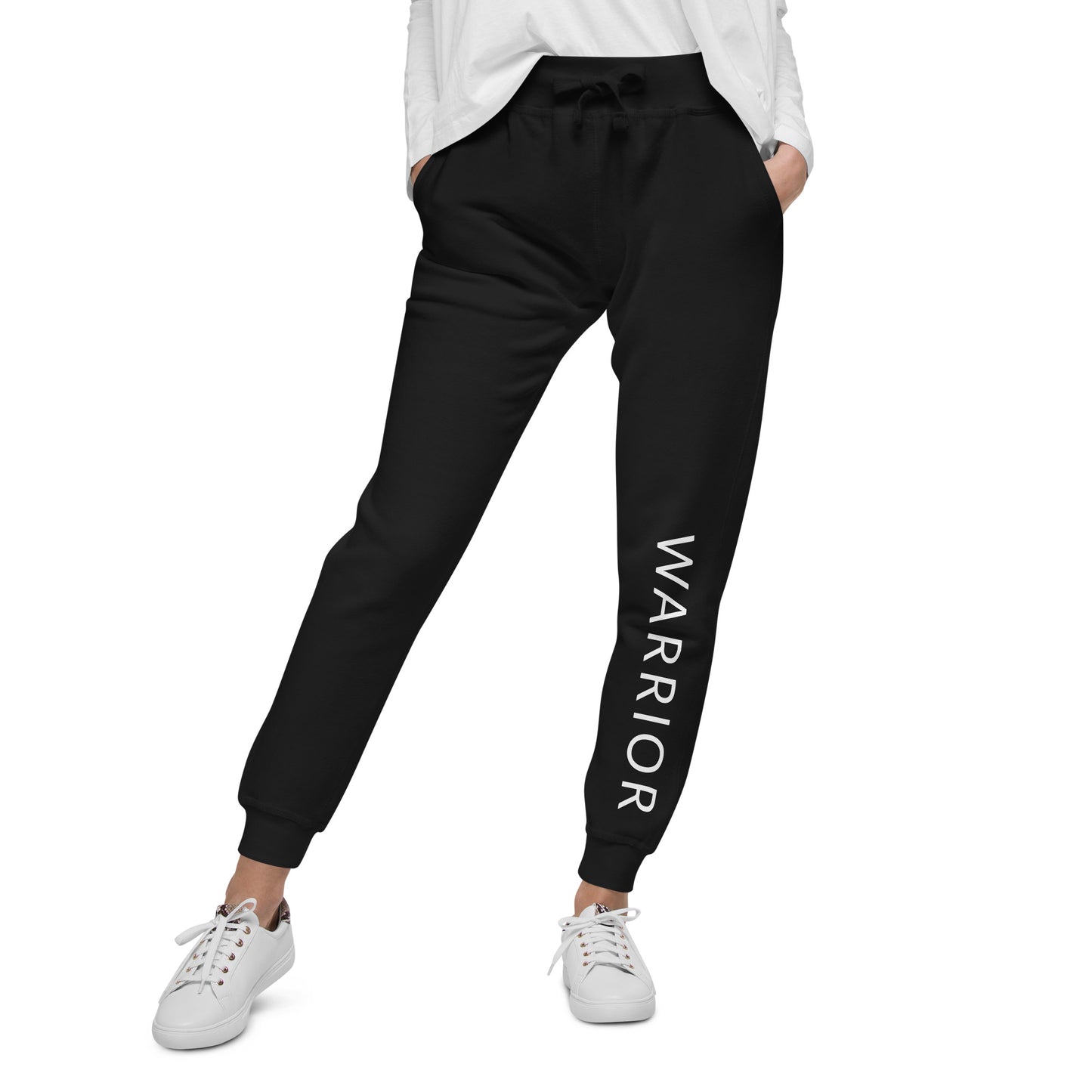 Woman with hands in front pockets sporting our motivational Warrior jogger sweatpants in black