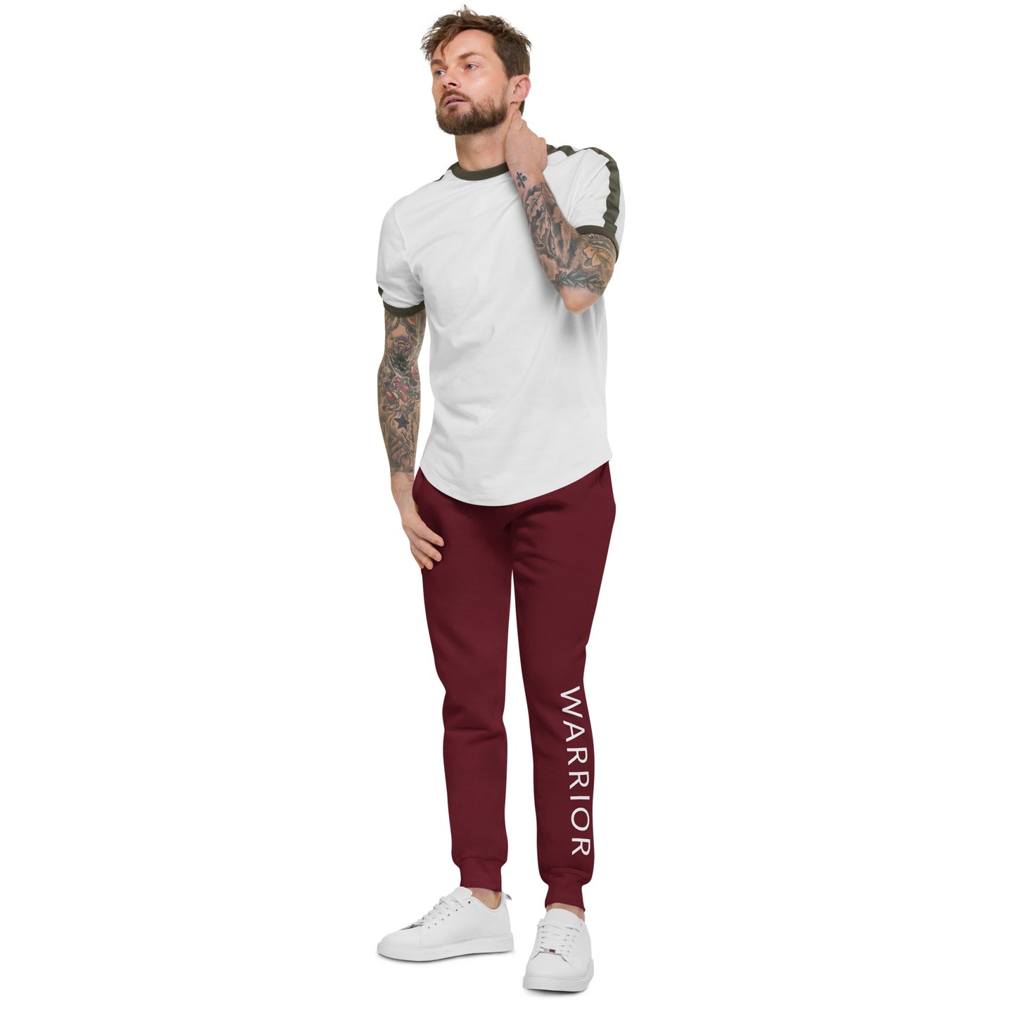 Tattooed male model stylishly wearing Warrior maroon slim fit jogger sweatpants