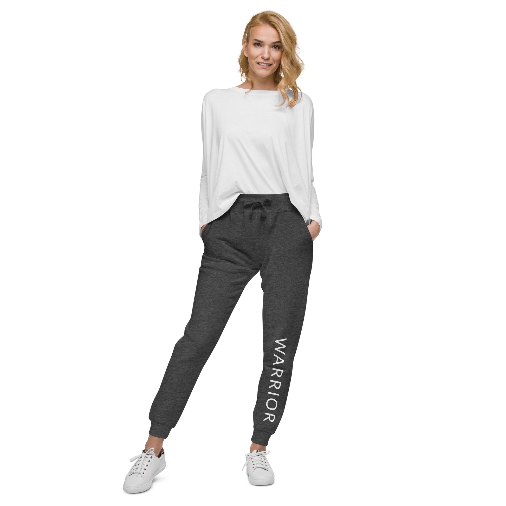 Stylish woman sporting our cozy mental health Warrior fleece joggers in charcoal heather