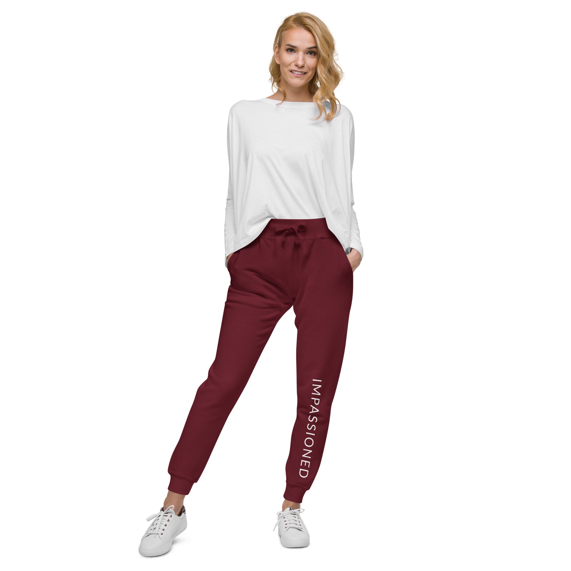 Beautifully worn slim fit maroon fleece jogger sweats with white shirt tucked in gives a cool, casual style